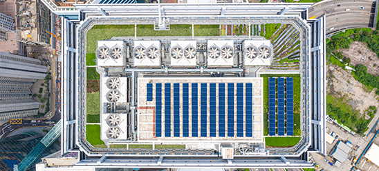 Aerial view of corporate building rooftop with solar panels